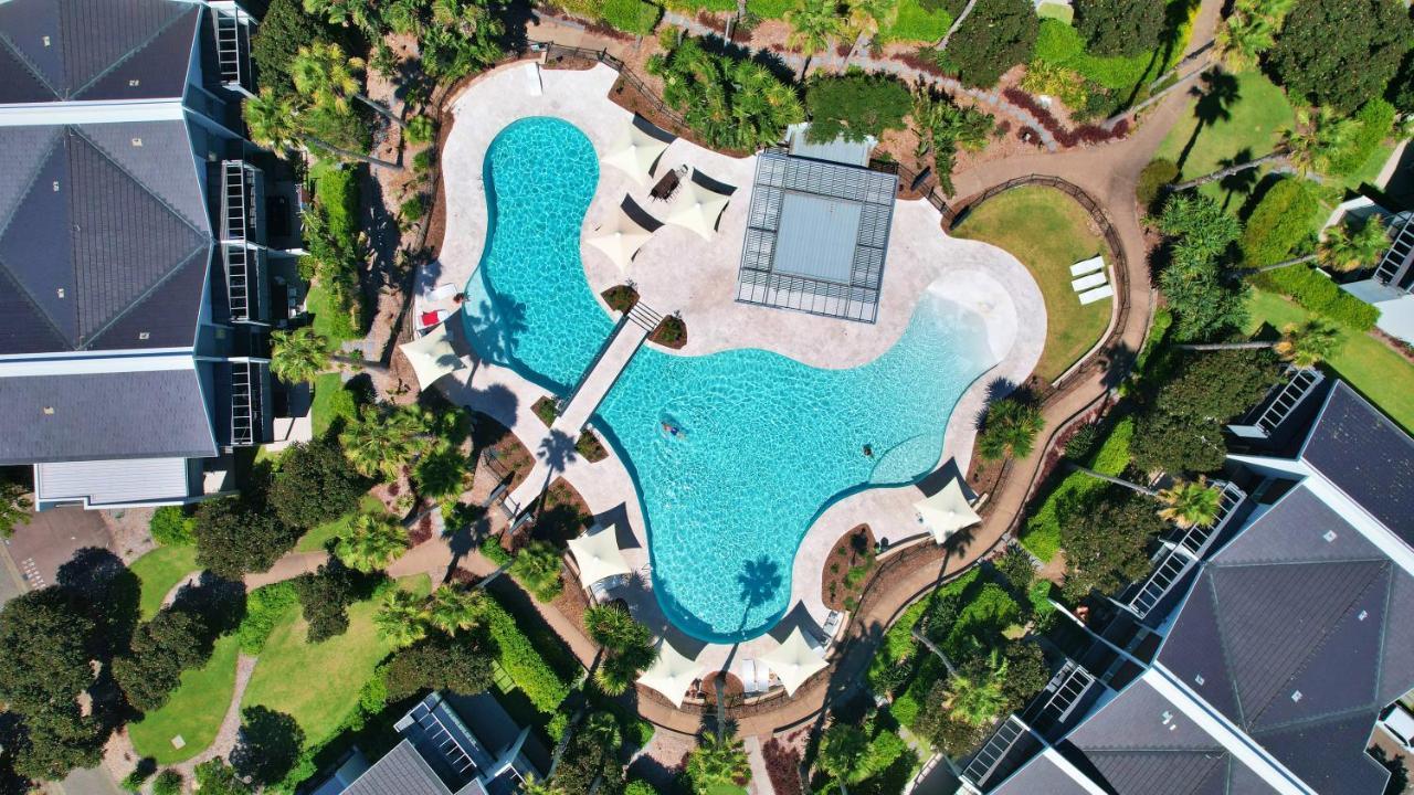 Pullman Magenta Shores Resort Entrance Eksteriør bilde Aerial view of the pool at the 2018 Commonwealth Games